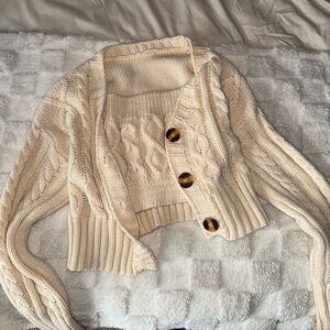 Cropped sweater cardigan with matching tube top sweater.